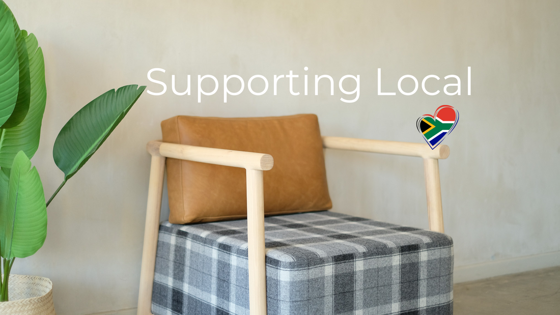 A Begin Interiors occasional chair with a South African flag heart tp indicate supporting local shopping